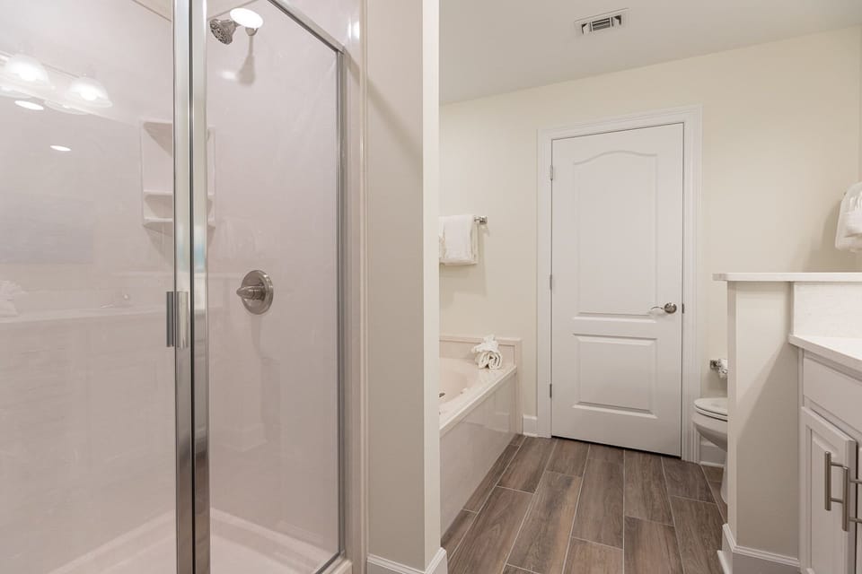 Indulge in relaxation in the master bath with a refreshing walk-in shower and soothing jetted tub