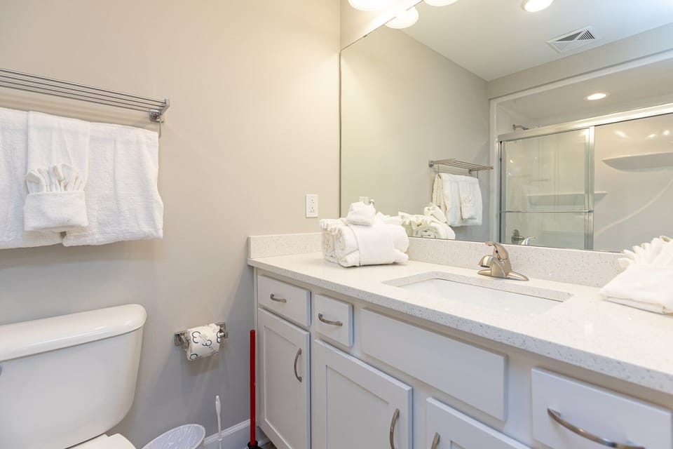 Step into a refreshing tub-shower combo and brighten your day in this guest bath