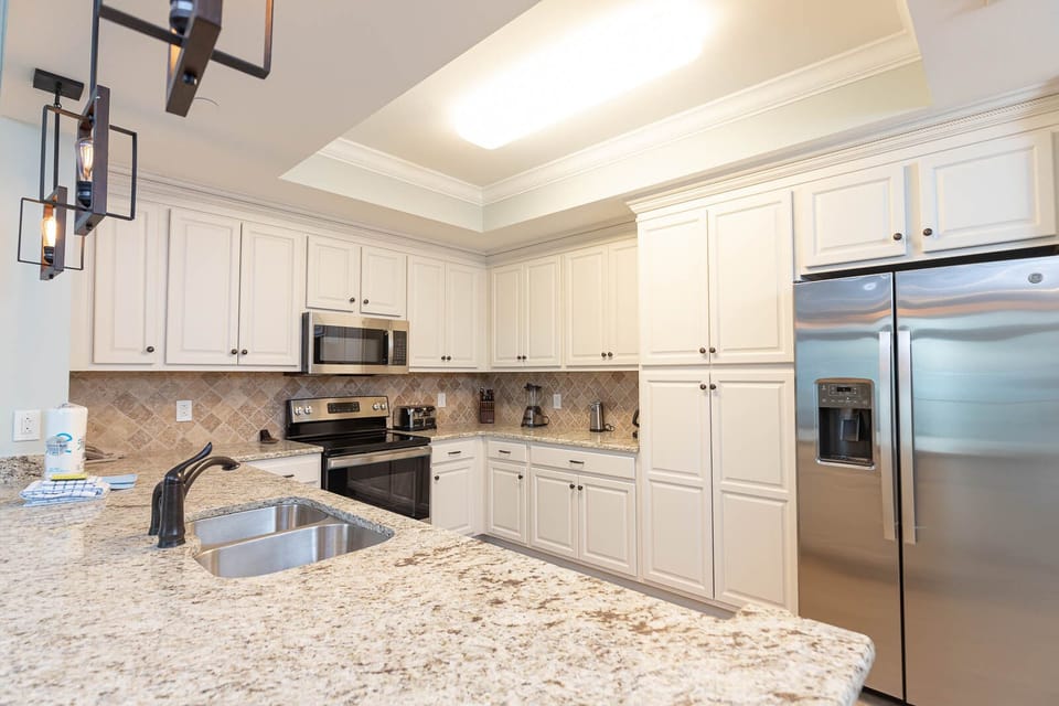Gather around the kitchen for meals with stainless appliances and spacious counters