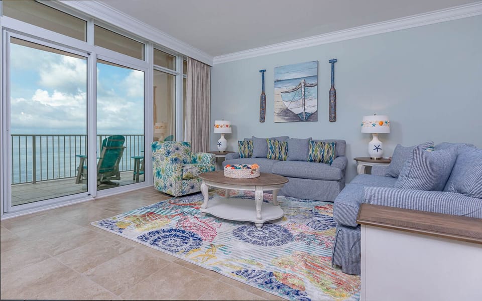 Relax in the floral armchair and feel the gulf breeze while watching the shore from the balcony