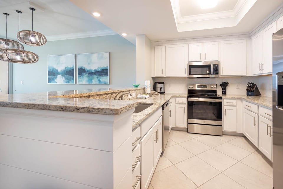 Prepare meals in this stylish kitchen with elegant cabinetry and stainless appliances