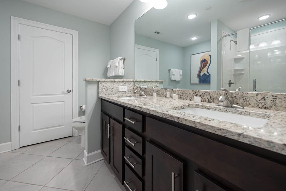 Freshen up at the double vanity with rich cabinetry, soak in the jetted tub, or enjoy a refreshing shower in the master bath