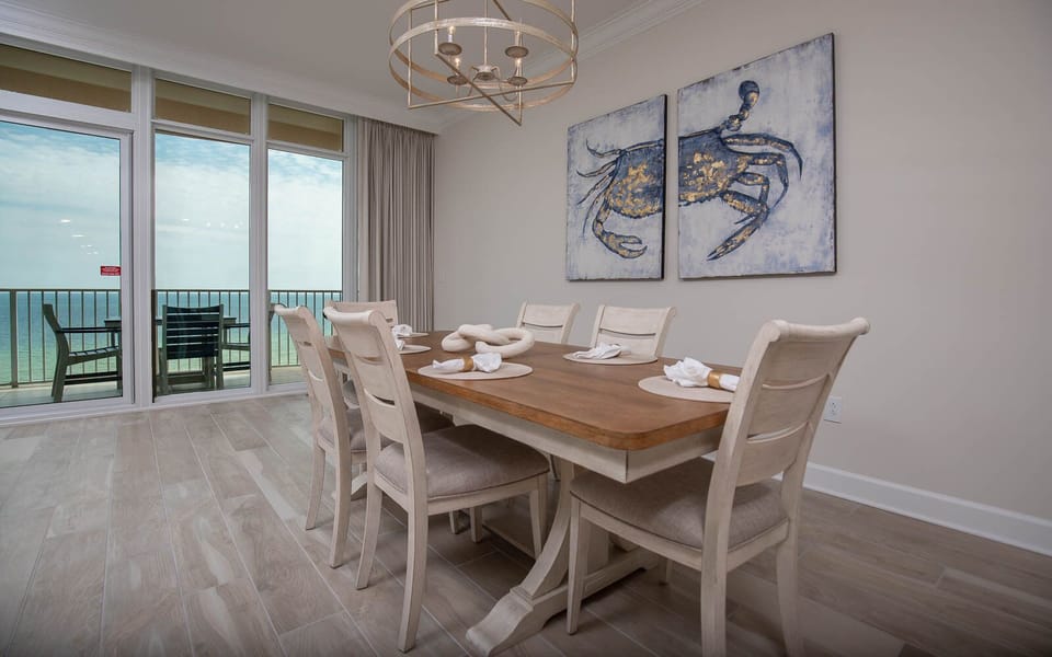 Settle into the dining chairs, then step onto the balcony to hear the gulf and watch the shore