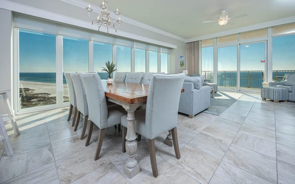 Picture yourself at the dining table, gazing through floor-to-ceiling windows at the gulf