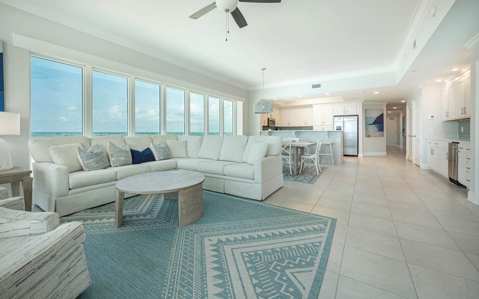 Settle into the armchair or cozy sectional by the coffee table, feel gulf breezes and watch the beach glisten