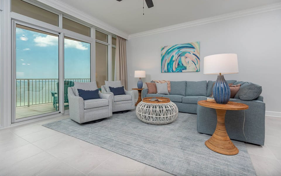Relax on the cozy sofa with a queen sleeper in this inviting family room with breathtaking beachfront views