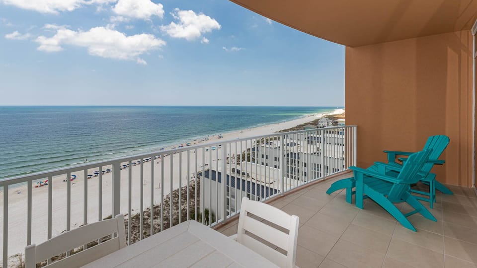 Settle into turquoise Adirondack chairs and listen to gulf waves from the beachfront balcony