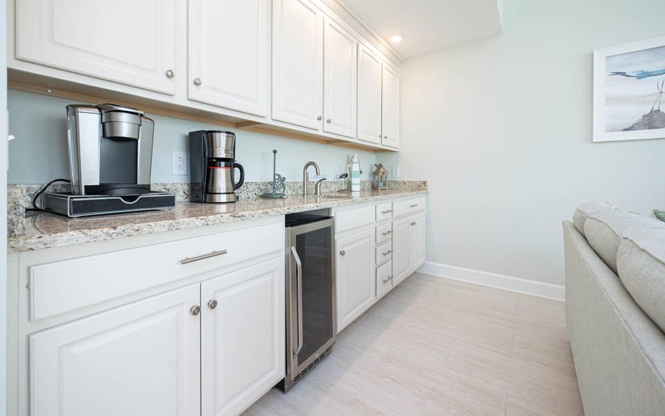 Brew fresh coffee at the wet bar, chill beverages in the wine cooler, and relax in this inviting space