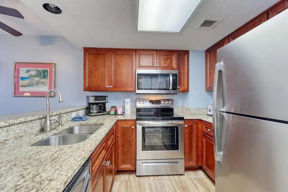 Well Stocked Kitchen with Stainless Steel Appliances