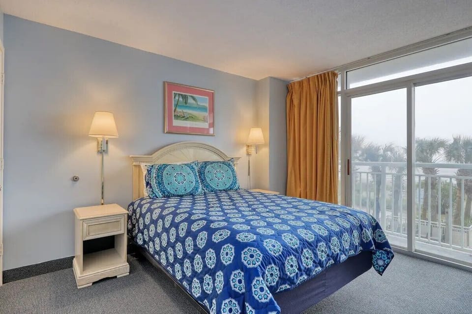 Wake up to breathtaking views with direct access to the private balcony.