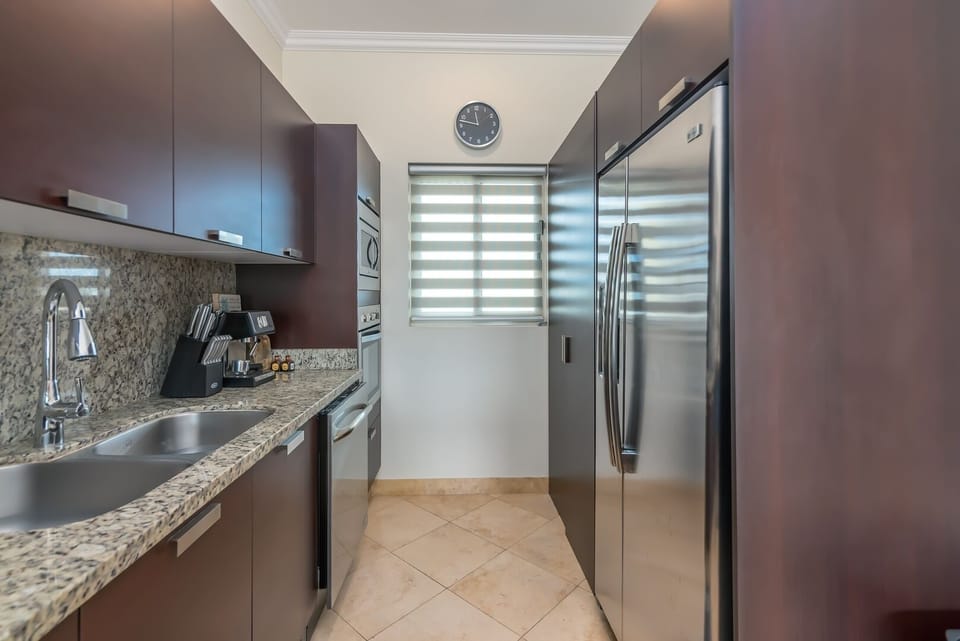 Kitchen Refrigerator and enclosed Laundry