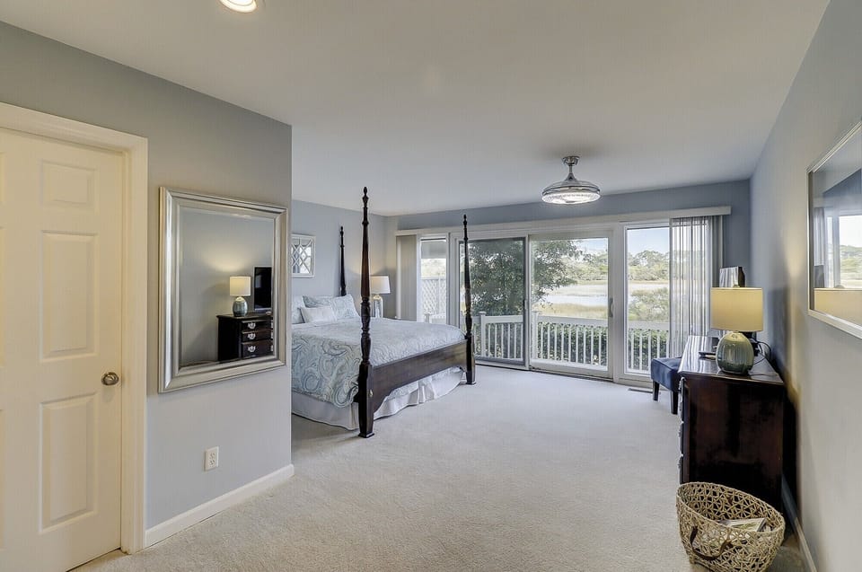 Ensuite w/ king, private bath, tidal marsh views, walk-in closet, & deck access 