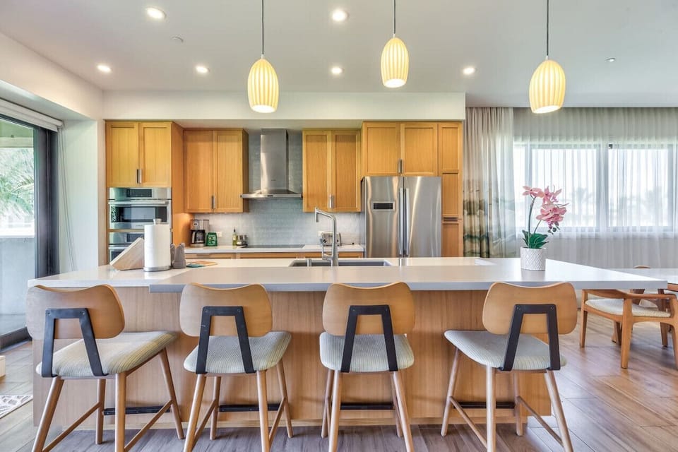 Cold water from the Kitchen Island Faucet provides filtered drinking and cooking water.