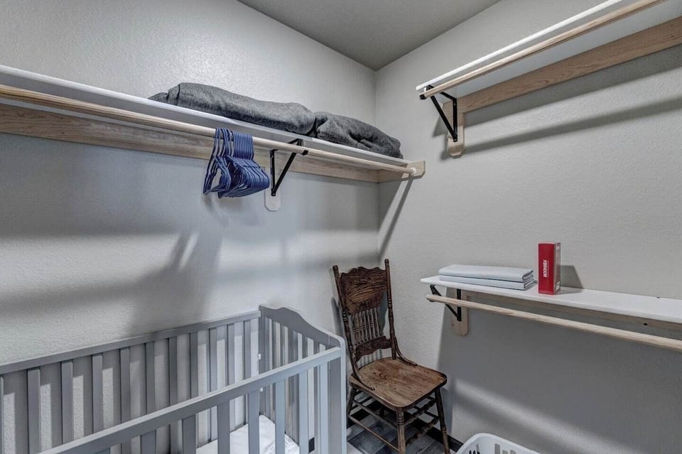 Master bedroom closet with mini-crib that is collapsible if more space is needed. 