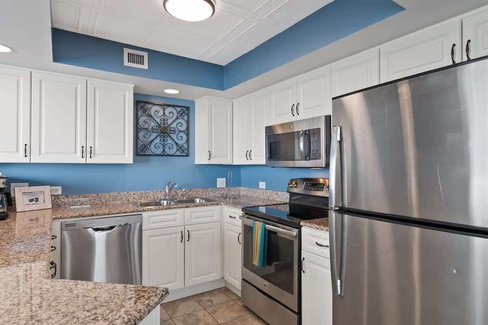 - Fully stocked kitchen with stainless appliances   - Granite counters and white cabinets for easy meals   - Prepare beach snacks or cook dinner after exploring