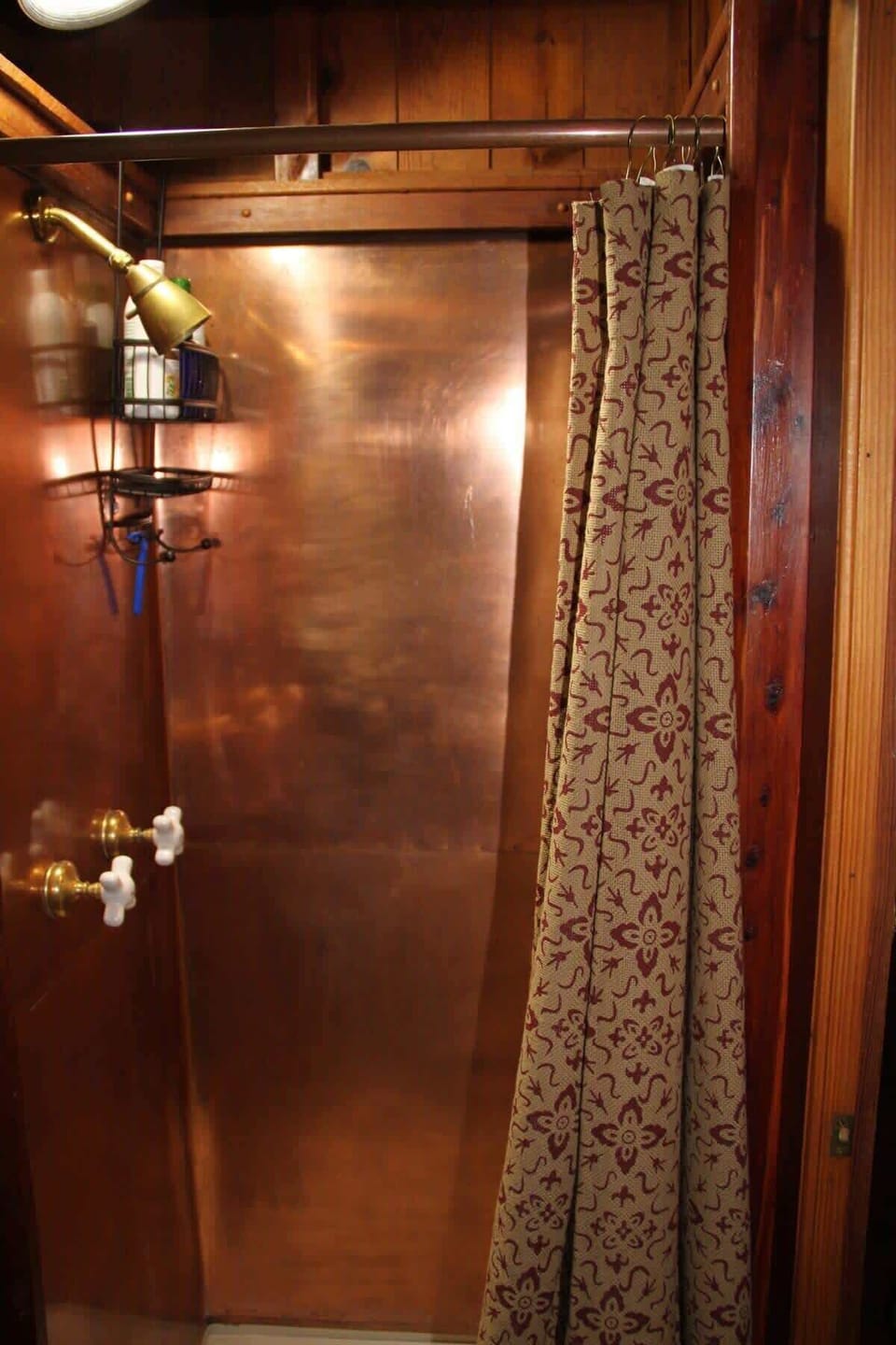 Walk-in copper shower.