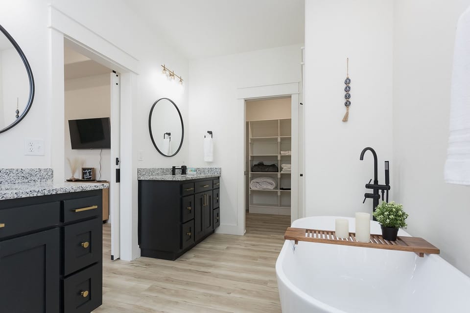 Double vanity and ample storage with walk in closet