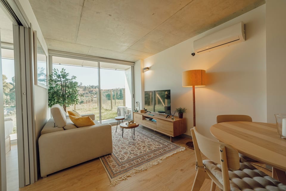 Deluxe Apartment, Garden View | Living area | TV