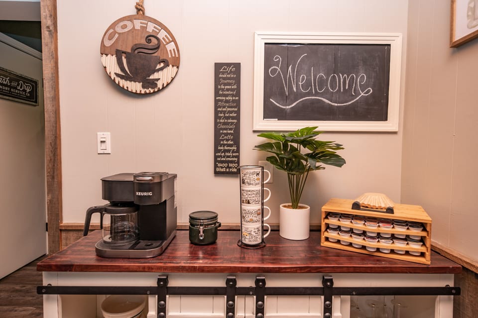 Coffee/Tea station featuring a KEURIG coffee machine & French coffee press.