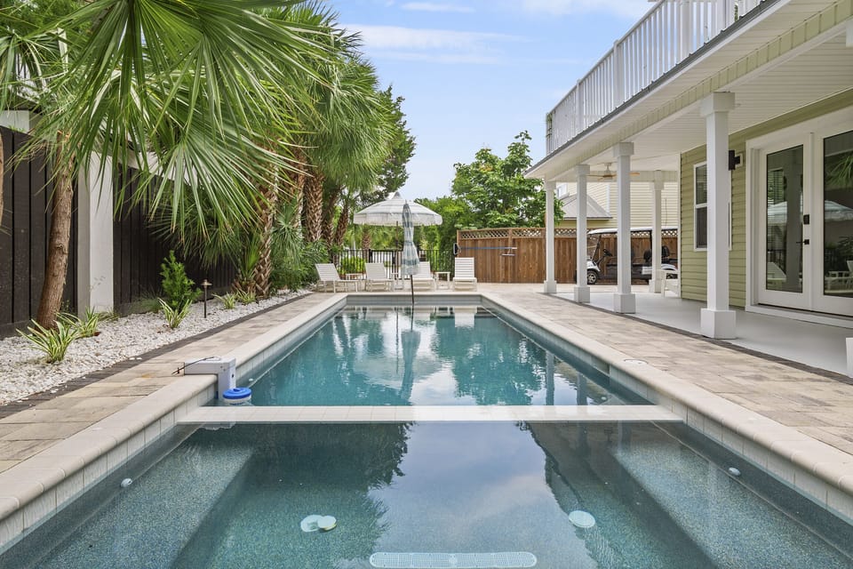 PRIVATE HEATED POOL + HOT TUB - Unlike other nearby rentals, heating the pool is FREE! Around the pool, there are lounge chairs, mood lighting, and a large gas grill
