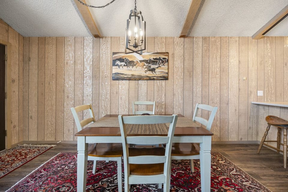 The dining table provides seating for four