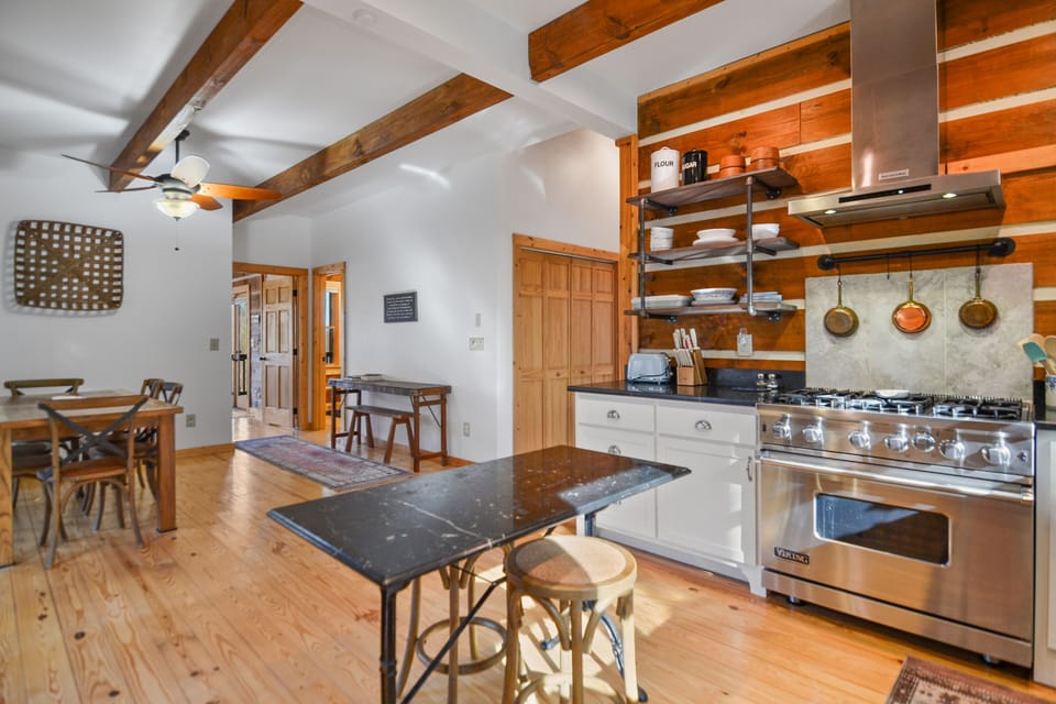 Rustic Kitchen with oversized gas stove open concept design 