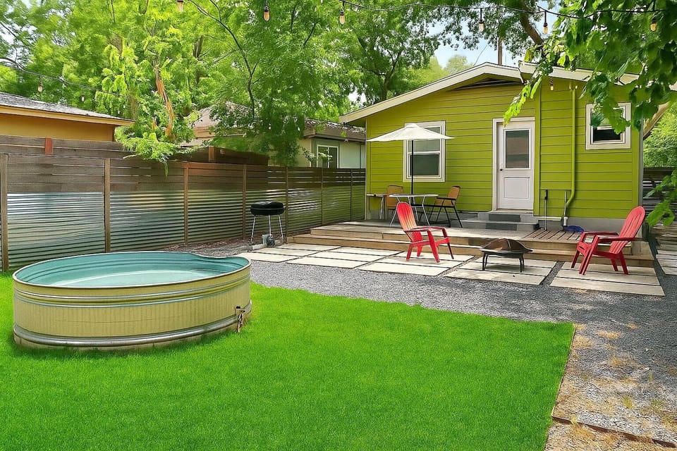 Fireplace, sitting area and cowboy pool in the spacious fenced back yard