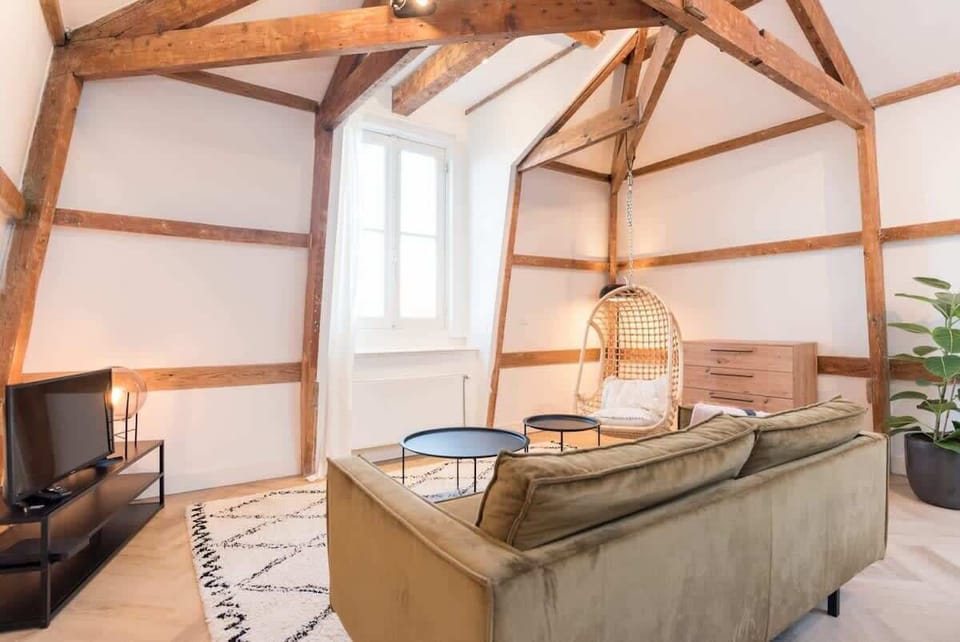 Living area features a TV for you to use during your stay