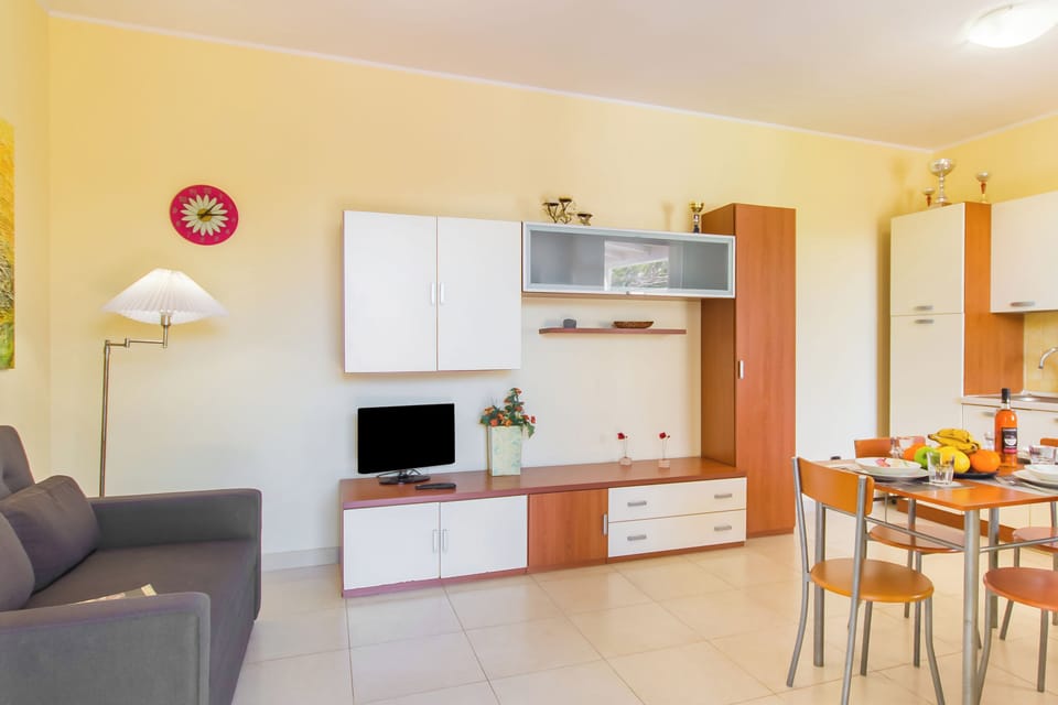 Family House, 2 Bedrooms, 2 Bathrooms (Villetta Relax with Garden, Pool and) | Living area | Flat-screen TV