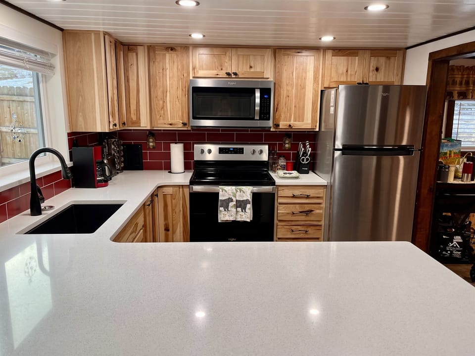 Stainless steel appliances and gorgeous cabinets
