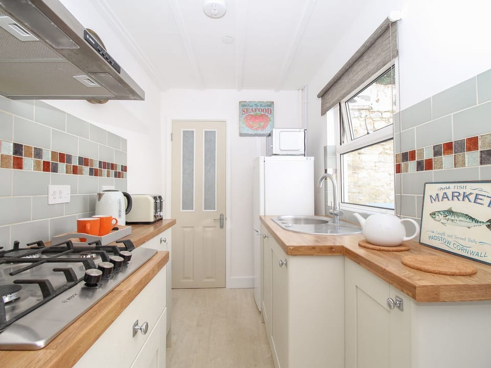 Fridge, electric kettle, toaster, cookware/dishes/utensils