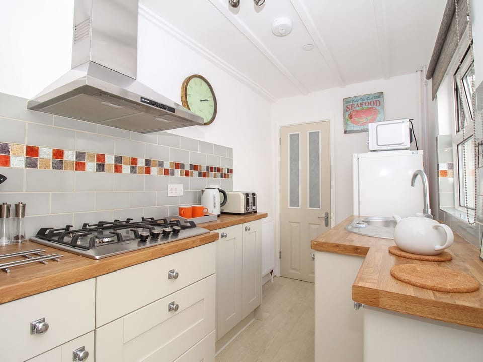Fridge, electric kettle, toaster, cookware/dishes/utensils