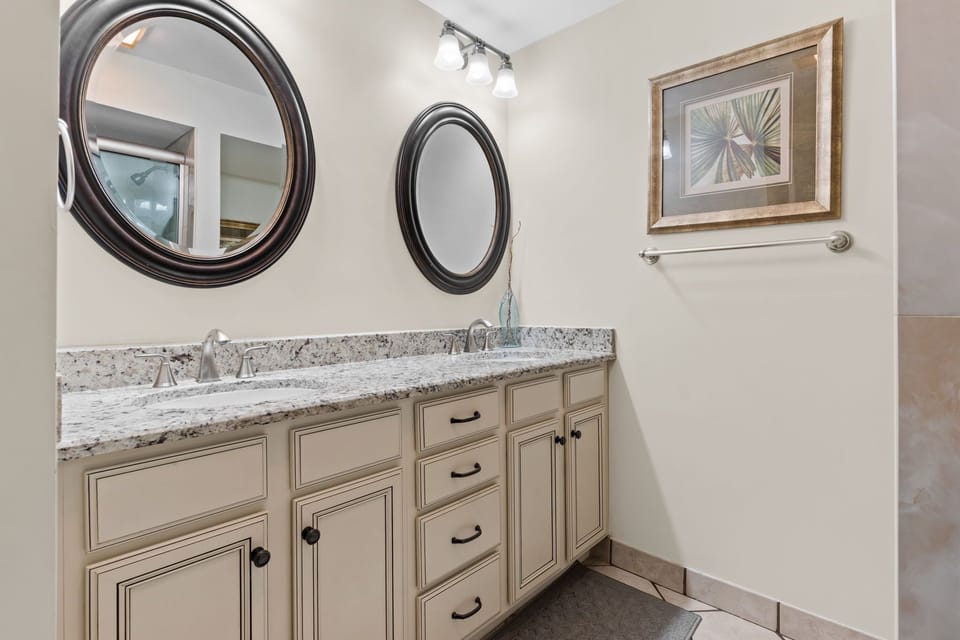 The master bath boasts dual vanities, large mirrors, and ample drawer space for all your essentials.
