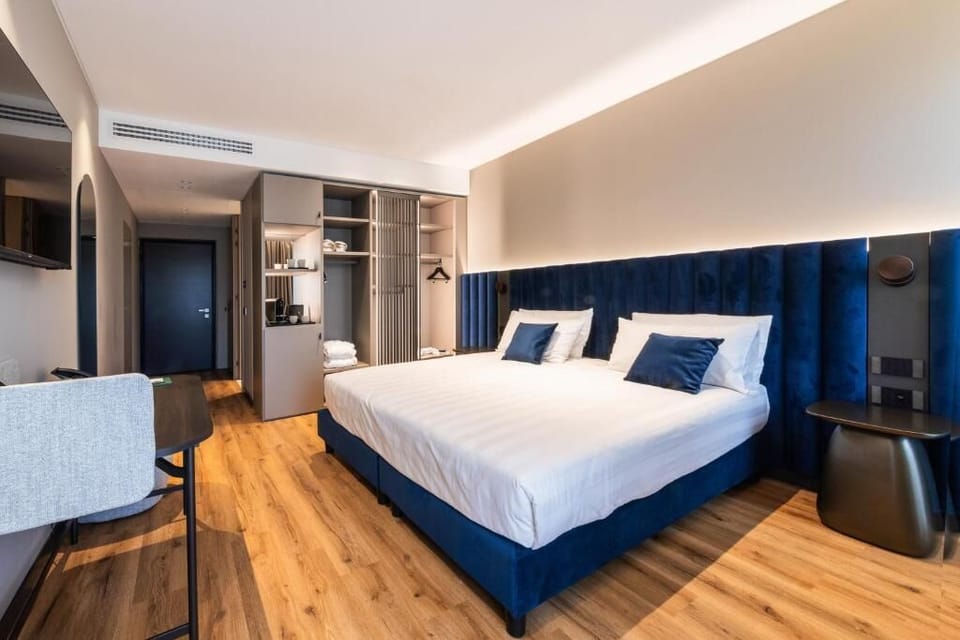 Premium Room, Balcony, Pool View | Minibar, in-room safe, blackout drapes, soundproofing