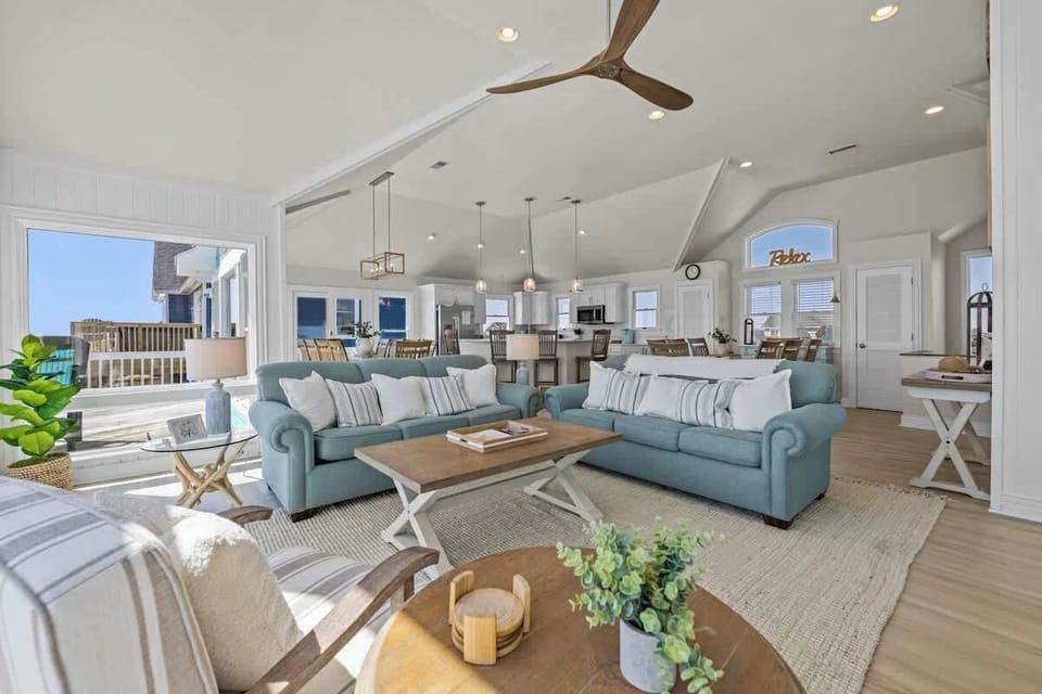 The open concept living room has a smart TV and great ocean view!