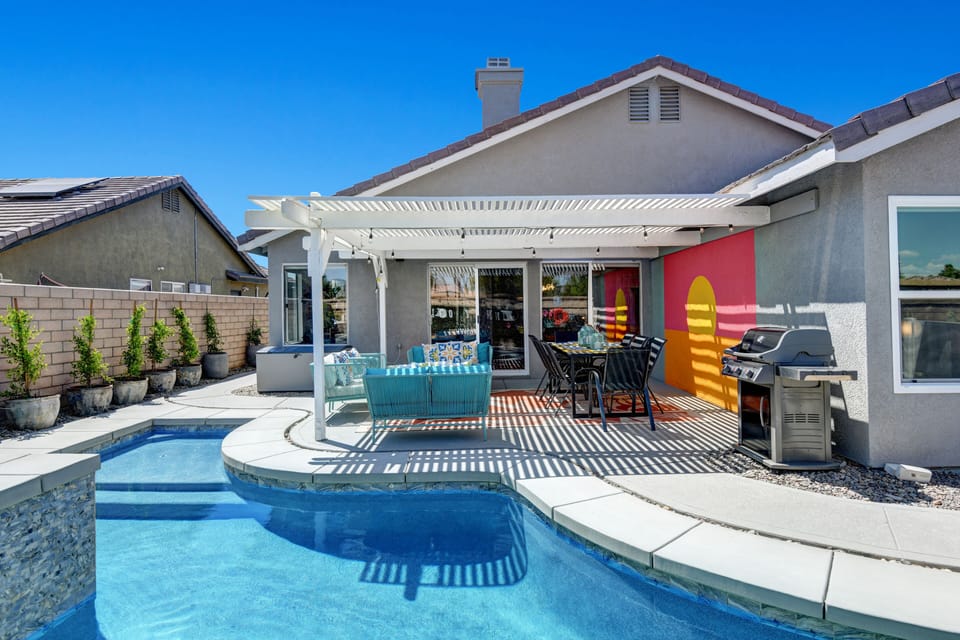 Shaded patio space perfect for BBQing & hanging w/friends. Eternal summer...