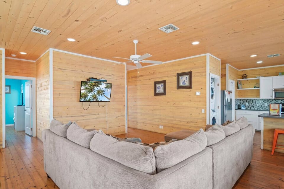 Comfy living space with large sectional + TV.