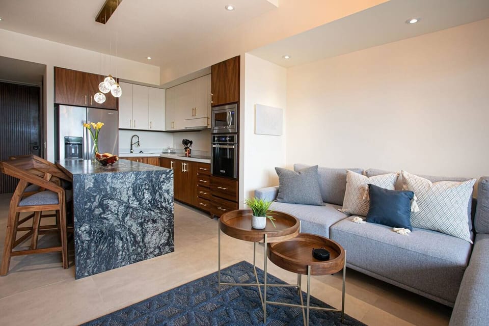Unwind in a stylish, upscale living room complete with a high-end convertible sofa that provides both comfort and versatility for your stay.