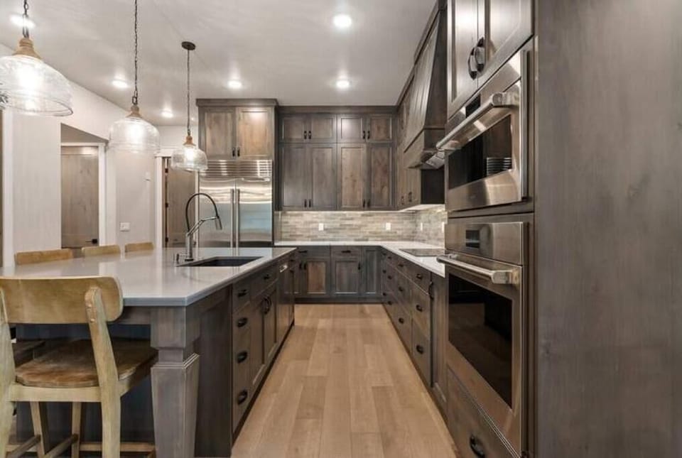 Chef's kitchen with Wolf oven and steam oven, Sub Zero fridge, and pebble ice 