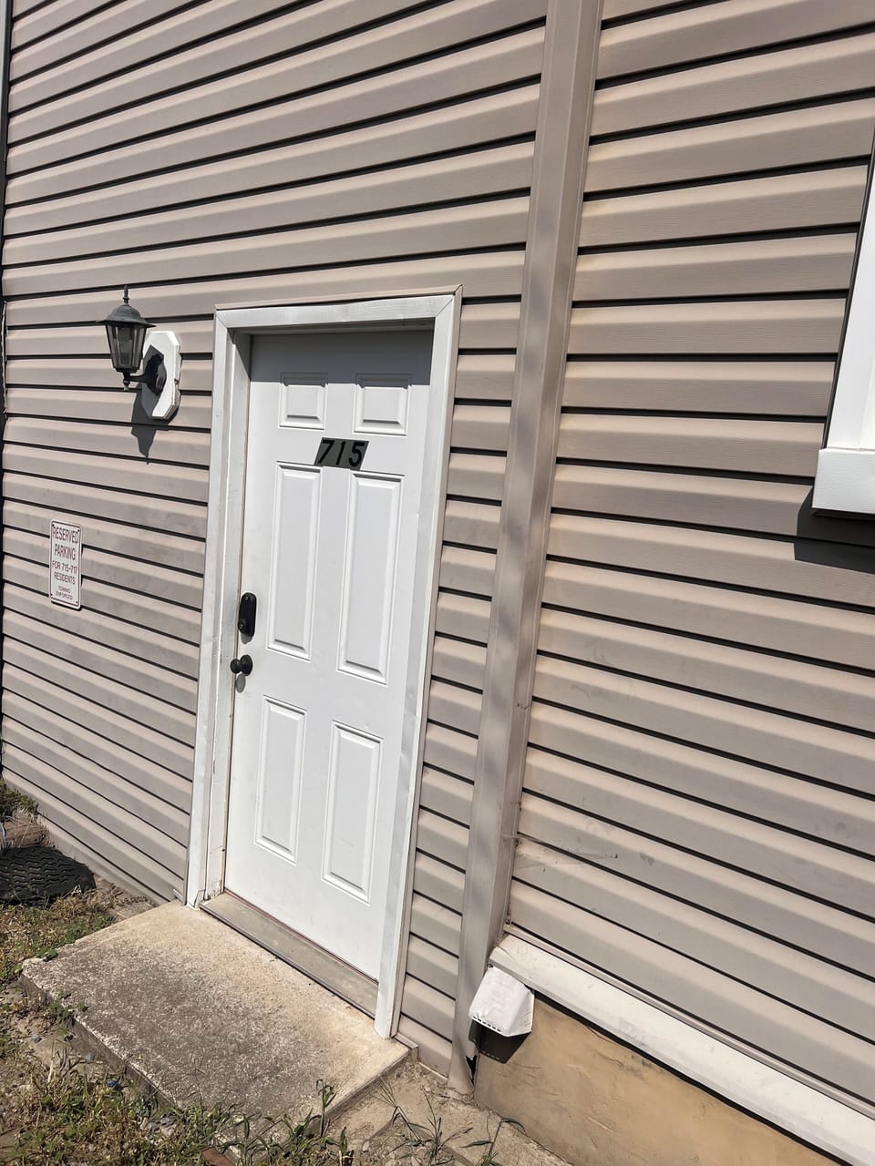 Private rear entrance with personalized door code entry 