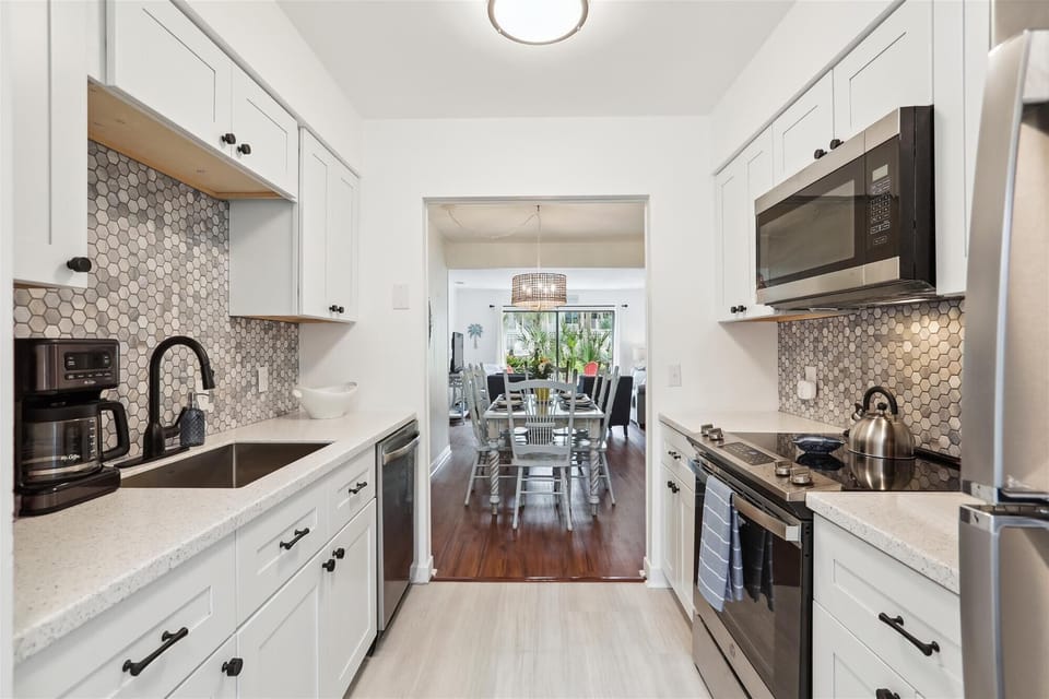 A fully-equipped kitchen has everything necessary to whip up a meal, while the combined living and dining area invites moments of laughter and connection with loved ones.