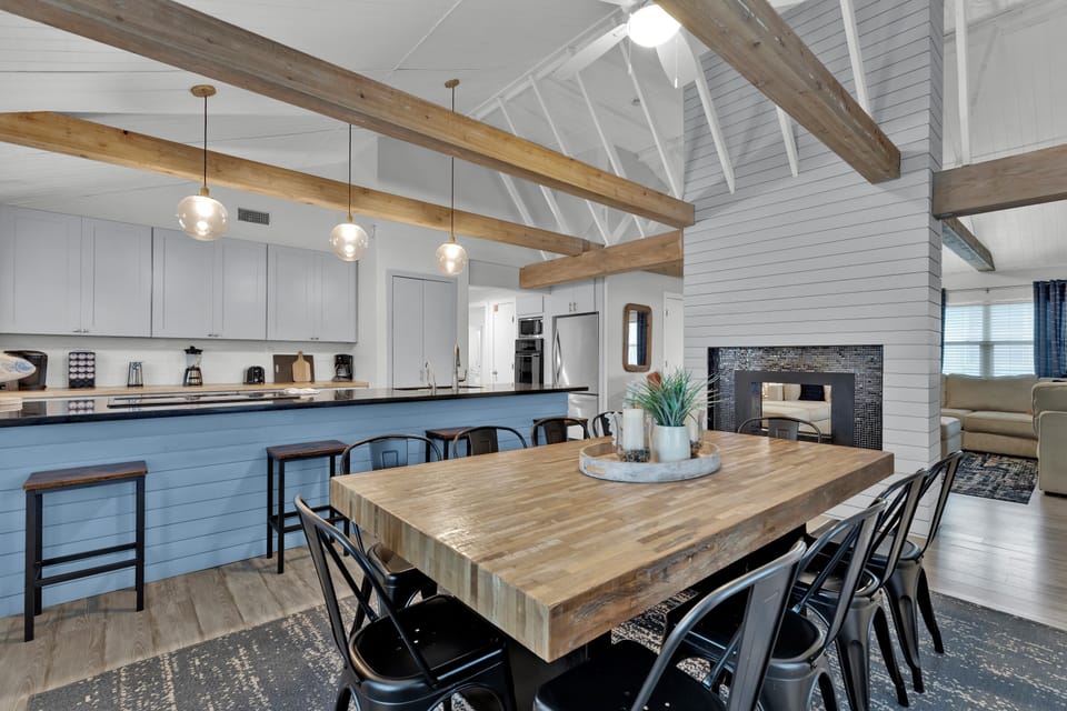 Dining room with kitchen in the background