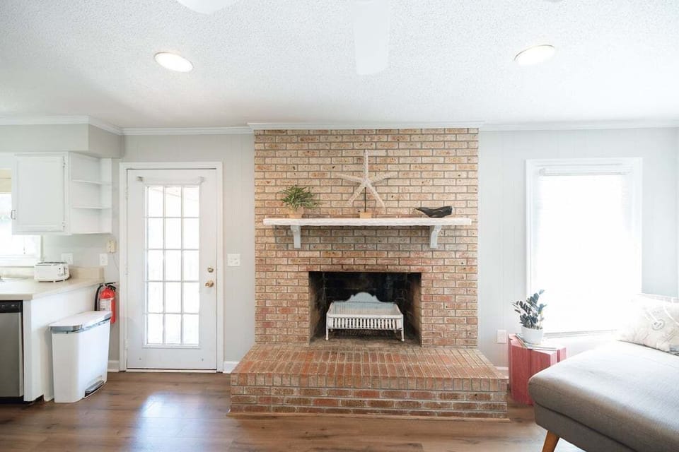 Bright and airy open-concept living space with comfortable seating and a Smart TV