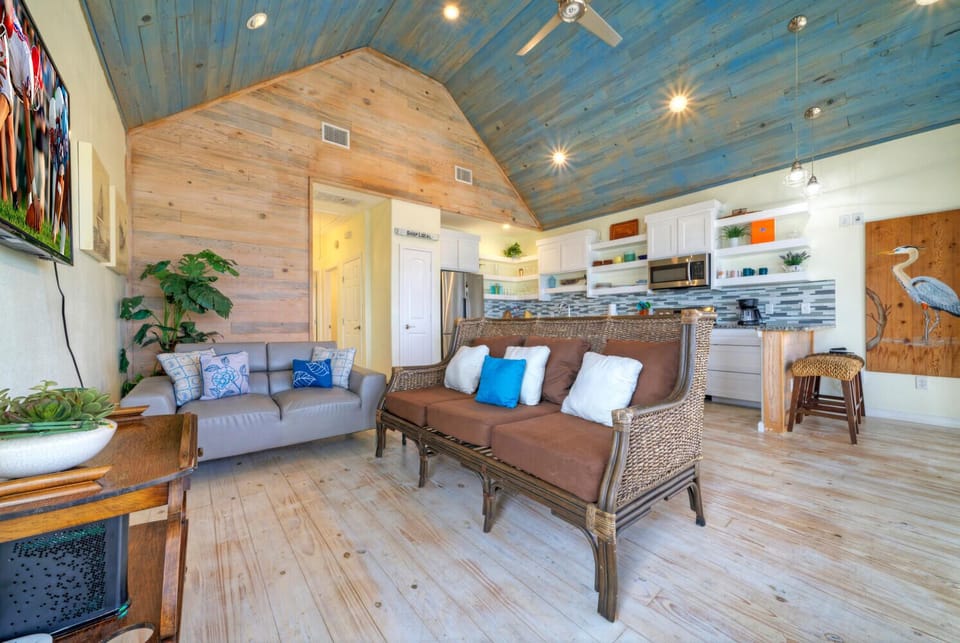 Beautiful blue ceiling and wood walls add a rustic and coastal flare.
