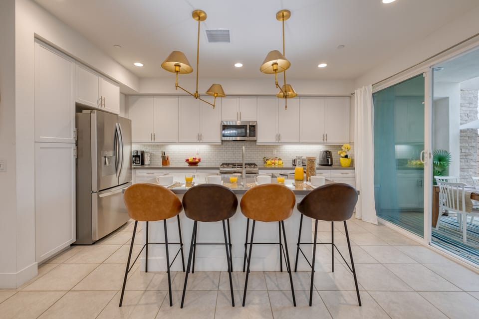 Kitchen is fully equipped and features stainless steel appliances.