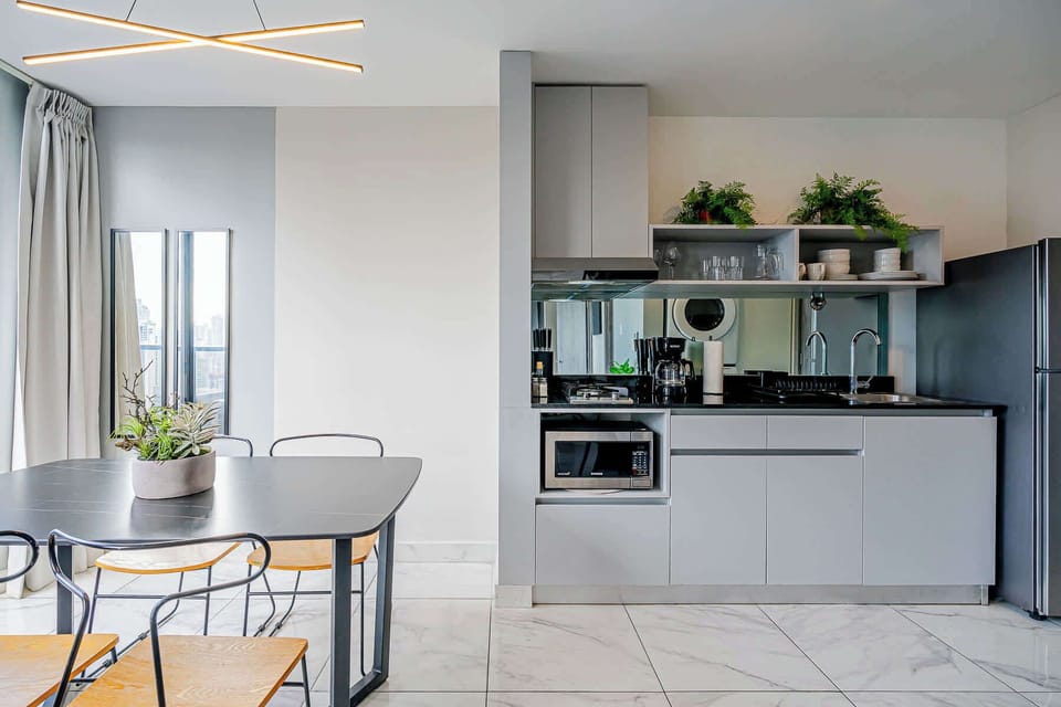 Fully equipped kitchen with a dining area for two.