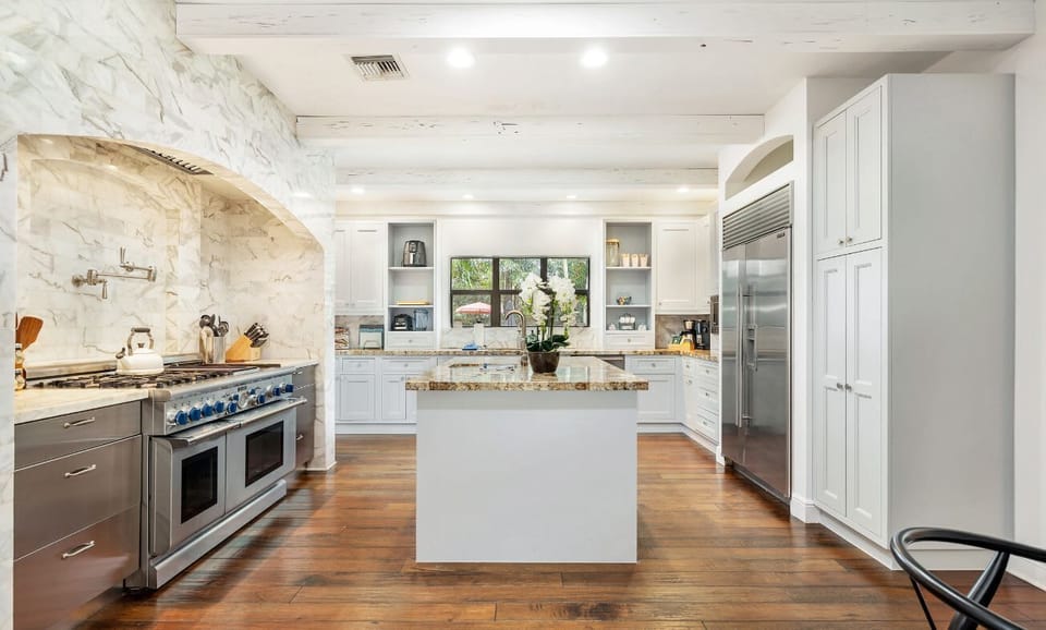 spacious kitchen with a large island and stainless steel appliances