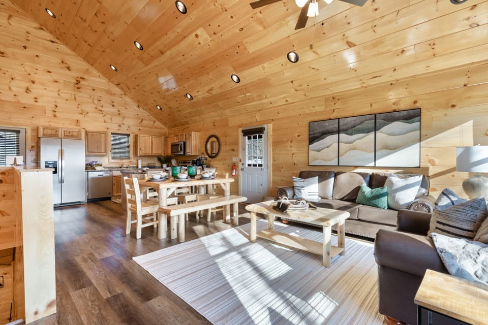 Signature Cabin, Multiple Bedrooms, Hot Tub, River View | Living room | 65-inch Smart TV with cable channels, fireplace