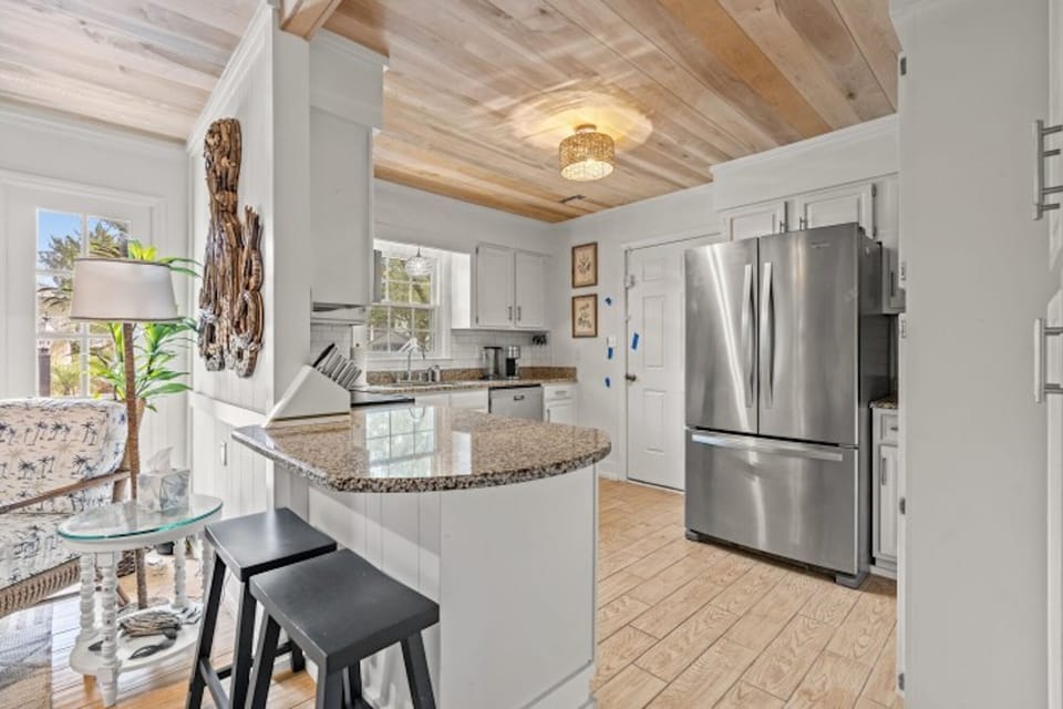 The kitchen counter provides additional  space for serving snacks or meals.
