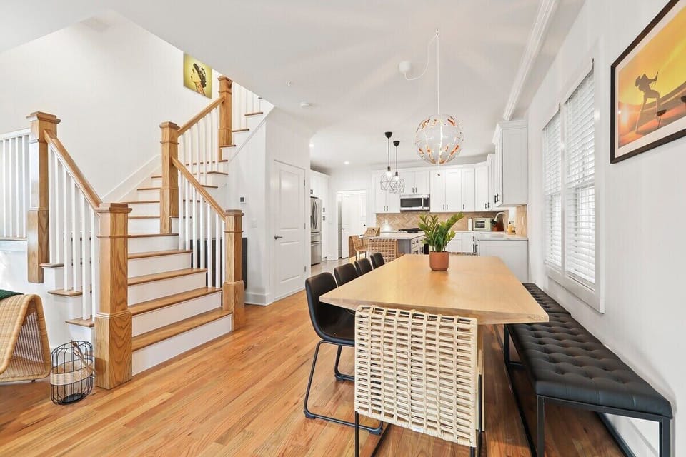 Dining Room-Gather for a cozy meal in this charming, sunlit dining nook that provides a perfect spot for memorable family dinners or a quick breakfast before heading out. 